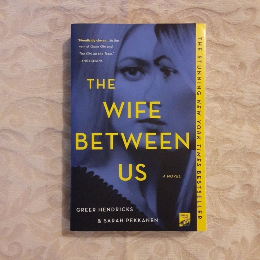 The Wife Between Us by Greer Hendricks & Sarah Pekkanen - Yellow and Black Cover